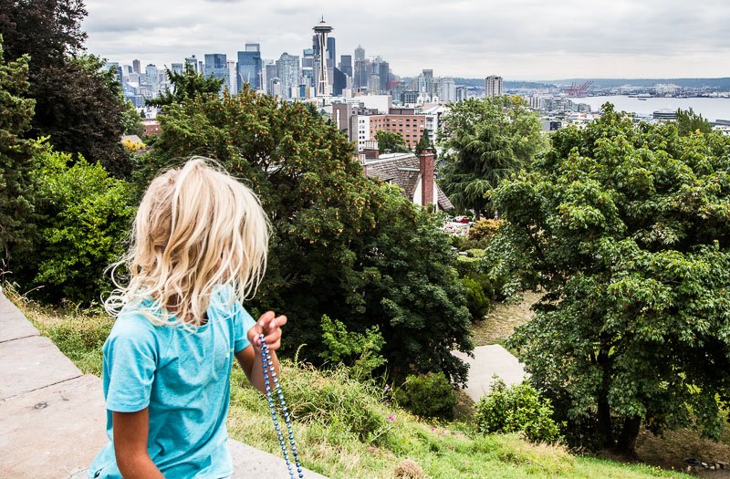 young girl looking at view of seattle skyline from Kerry Park